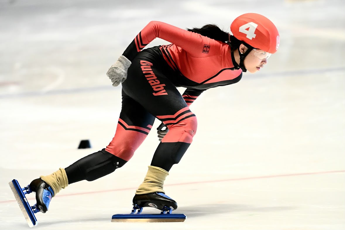 Burnaby speed skater racing at full stride